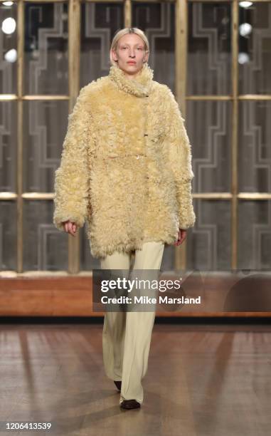 Model walks the runway at the Petar Petrov show during London Fashion Week February 2020 at the Royal Institute of British Architects on February 15,...