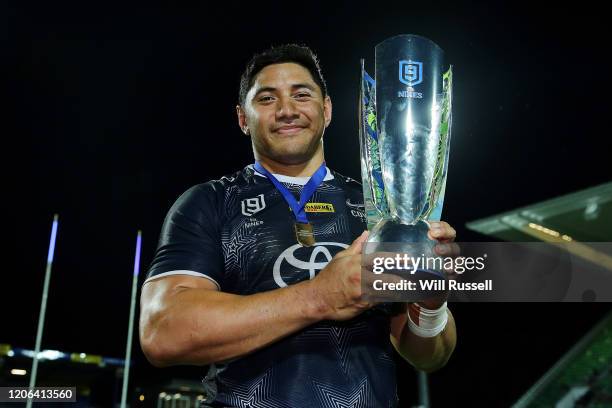 Jason Taumalolo of the Cowboys holds under pressure from the trophy after winning the Final against the Dragons during Day 2 of the 2020 NRL Nines at...