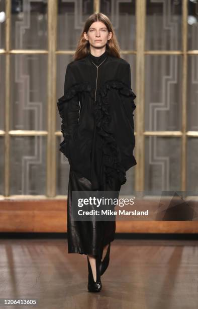 Model walks the runway at the Petar Petrov show during London Fashion Week February 2020 at the Royal Institute of British Architects on February 15,...