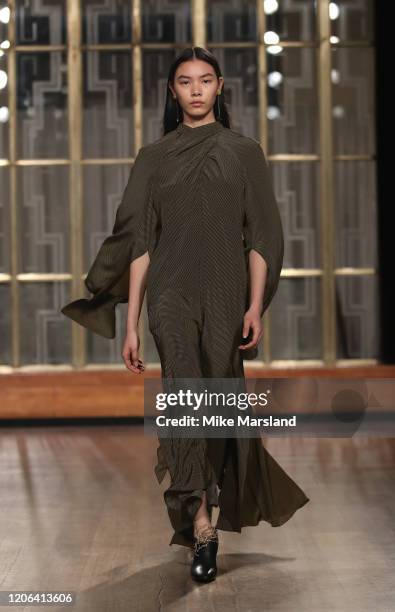 Model walks the runway at the Petar Petrov show during London Fashion Week February 2020 at the Royal Institute of British Architects on February 15,...