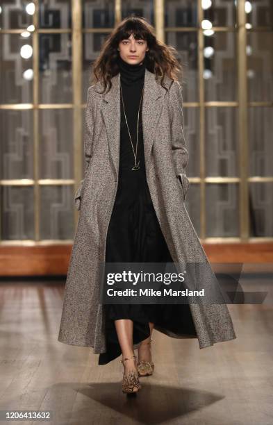 Model walks the runway at the Petar Petrov show during London Fashion Week February 2020 at the Royal Institute of British Architects on February 15,...