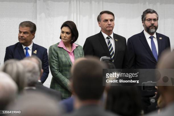 Ernesto Araujo, Brazil's foreign affairs minister, from right, Jair Bolsonaro, Brazil's president, and Michelle Bolsonaro, Brazil's first lady,...