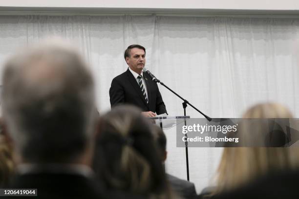 Jair Bolsonaro, Brazil's president, speaks during an event with supporters at the Miami Dade College Auditorium in Miami, Florida, U.S., on Monday,...