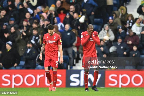 Tobias Pereira Figueiredo and Samba Sow of Nottingham Forest react after conceding a goal during the Sky Bet Championship match between West Bromwich...