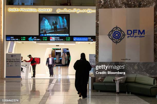 Investors visit the Dubai Financial Market PJSC in Dubai, United Arab Emirates, on Tuesday, March 10, 2020. The Middle Easts travel and business hub...