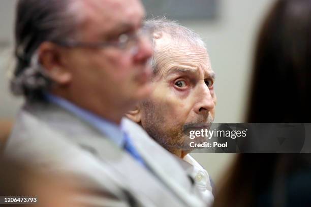 Real estate heir Robert Durst, center, sits with his co-defense attorney David Chesnoff during his murder trial on March 10, 2020 in Los Angeles,...