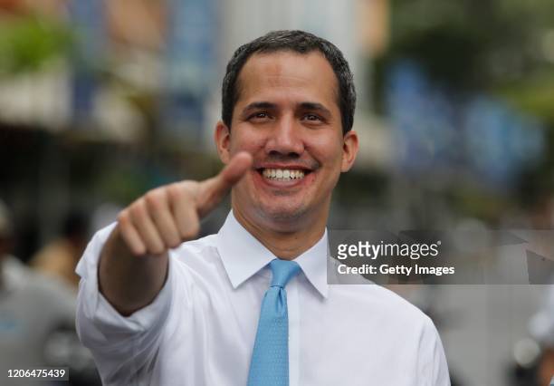 Venezuelan opposition leader Juan Guaido, recognized by many members of the international community as the country's rightful interim ruler, gives a...
