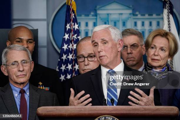 Vice President Mike Pence, standing with members of the White House Coronavirus Task Force team, speaks during a press briefing in the press briefing...