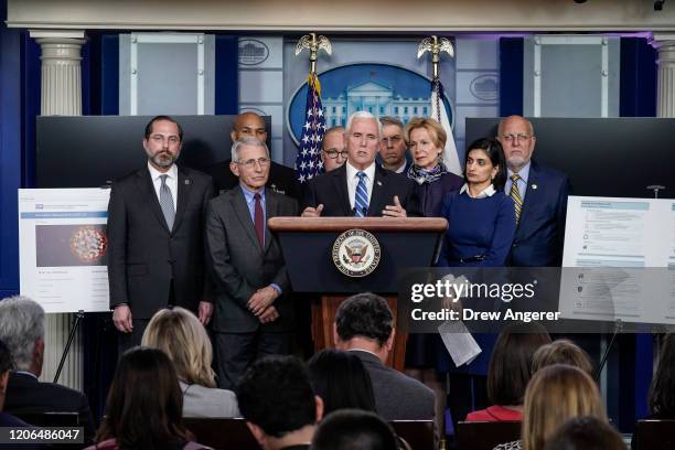 Vice President Mike Pence, standing with members of the White House Coronavirus Task Force team, speaks during a press briefing in the press briefing...