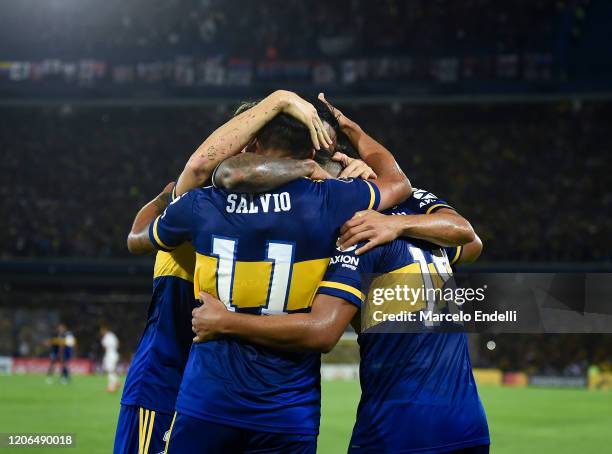 Eduardo Salvio of Boca Juniors celebrates with teammates after scoring the first goal of his team during a Group H match between Boca Juniors and...