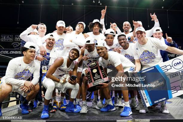 The Hofstra Pride celebrate winning the CAA Men's Basketball Tournament - Championship college basketball game against the Northeastern Huskies at...