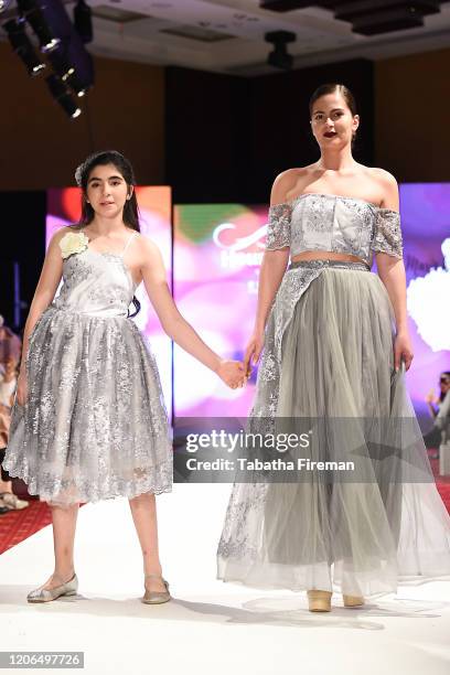 Model walks the runway for Marie Belle Couture at the House of iKons show at the Millennium Gloucester Hotel on February 15, 2020 in London, England.