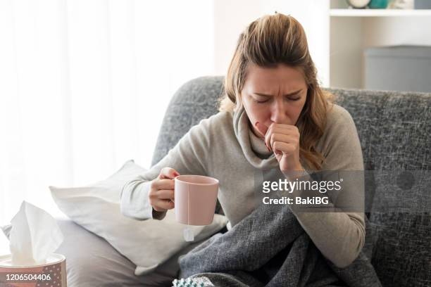 sick woman with flu at home - coughing stock pictures, royalty-free photos & images