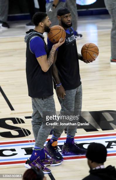 Anthony Davis and LeBron James of the Los Angeles Lakers meet during 2020 NBA All-Star - Practice & Media Day at Wintrust Arena on February 15, 2020...