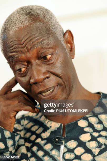 Electoral Commission Chairman Kwadwo Afari-Gyan looks at the script before declaring the presidential candidate of the opposition National Democratic...