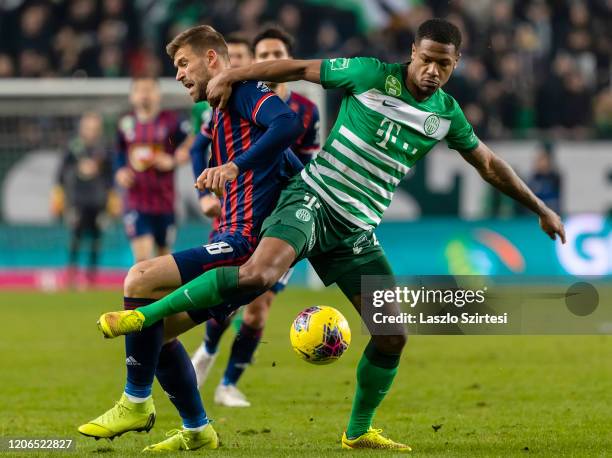 Lyes Houri of MOL Fehervar FC challenges David Siger of