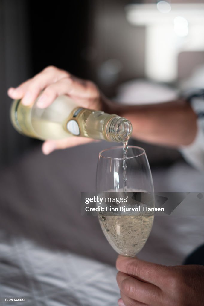 Pouring champagne into a glass closeup