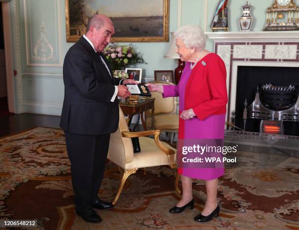Queen Elizabeth II, receives Professor Mark Compton, Lord Prior of the Order of St John, during an audience, where he presented Her Majesty with the...