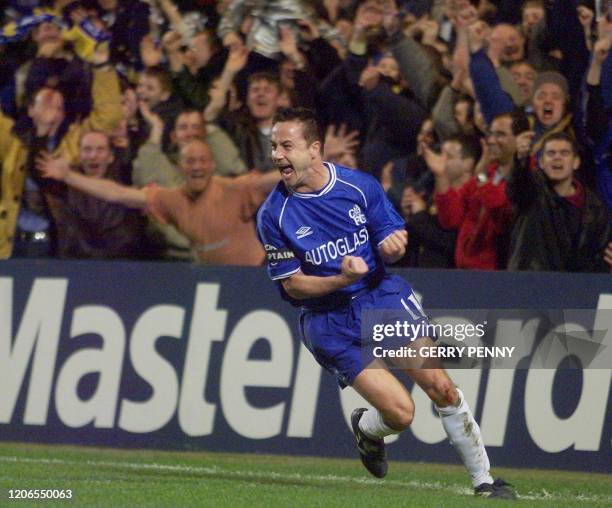 Chelsea's midfielder and captain Dennis Wise celebrates after scoring the first goal against Marseille 08 March 2000, during their UEFA Champions...