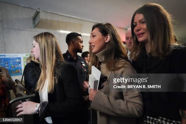 Jessica Mann and Dawn Dunning leave the courtroom following the sentencing of movie producer Harvey Weinstein at Manhattan Criminal Court on March...