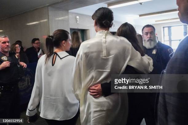 Tarale Wulff and Miriam Hailey leave the courtroom following the sentencing of movie producer Harvey Weinstein at Manhattan Criminal Court on March...