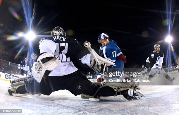 Goaltender Jonathan Quick of the Los Angeles Kings defends his net against Tyson Jost of the Colorado Avalanche during the first period of the 2020...