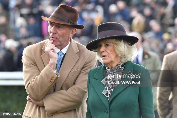 Martin St Quinton, Chairman of the Cheltenham Racecourse Committee with Camilla, Duchess of Cornwall as she attends the Ladies Day during Cheltenham...