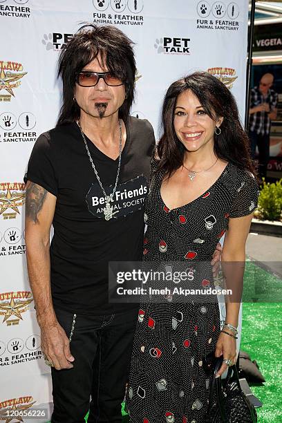 Robert Sarzo and his wife attend the 1st Annual "Cuts 4 Critters" Celebrity Green Carpet & Pet Adoption on August 7, 2011 in Tarzana, California.