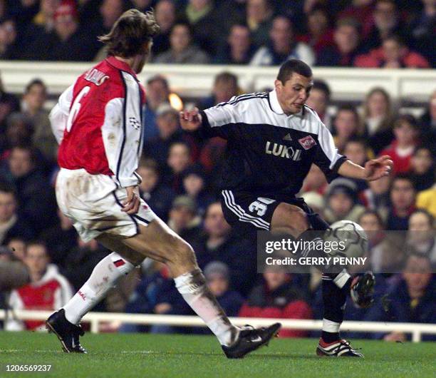 Spartak Moscow's Jafar Irismetov fights for the ball with Arsenal's captain Tony Adams 06 March 2001, during their EUFA Champions League match at...