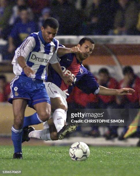 La Corogna's Djalminha of Brazil fights for the ball with PSG's Ali Benarbia 07 March 2001 in La Corogna during the Champions League match. AFP PHOTO...