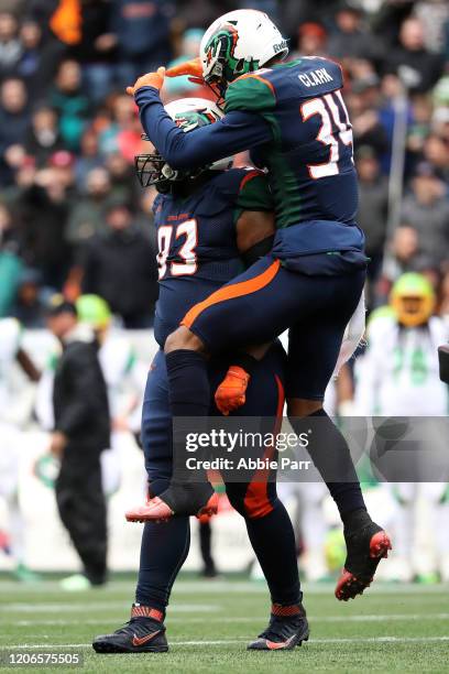 Will Sutton and Jeremy Clark of the Seattle Dragons celebrate a defensive play in the second quarter against the Tampa Bay Vipers during their game...