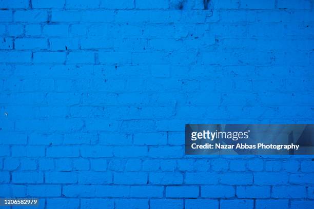 blue brick-wall background. - royal blue ストックフォトと画像