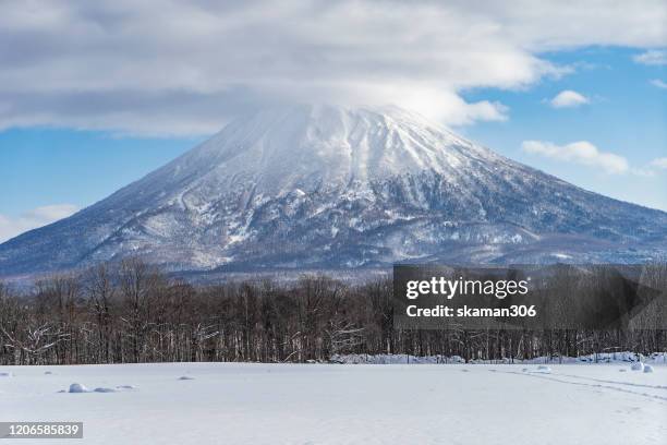 beautiful landscape view of little fuji mountain yotei  cover by snow and village near niseko hokkaido japan 2020 - hirafu snow resort stock pictures, royalty-free photos & images