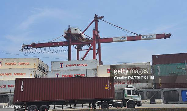 Container truck drives along a pier at Taiwan's busy northern Keelung harbour taken on August 8, 2011.Taiwan's July export figures hit a...