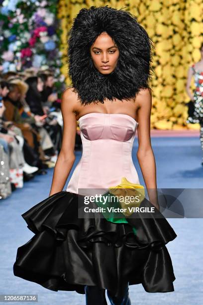 Model walks the runway at the Richard Quinn Ready to Wear Fall/Winter 2020-2021 fashion show during London Fashion Week on February 15, 2020 in...
