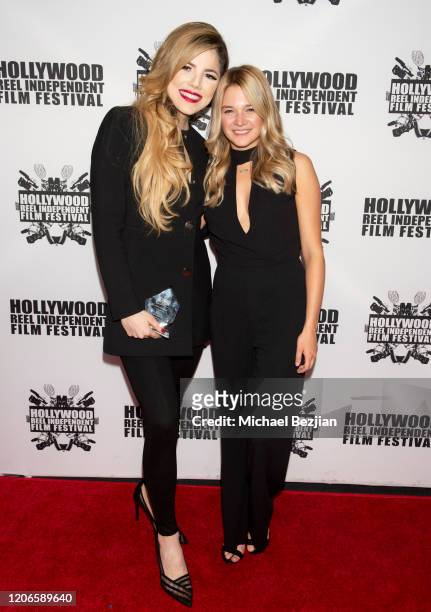 Maria Gabriela Cardenas and Kaitlyn Squires arrive at "A Dark Foe" Film Premiere on February 15, 2020 in Los Angeles, California.