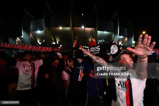 S supporters chant slogans as they arrive to attend the UEFA Champions League round of 16 second leg football match between Paris Saint-Germain and...