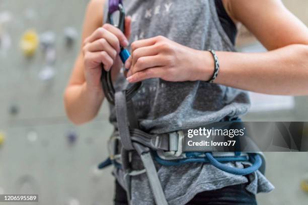 preparing for the climb - tighten stock pictures, royalty-free photos & images