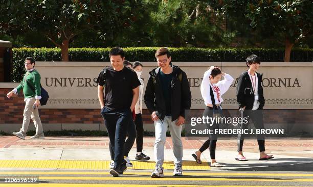 Students cross a crosswalk at the University of Southern California in Los Angeles, California on March 11 where a number of southern California...