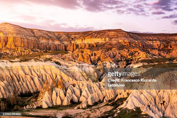 sunset over rose and red valley, cappadocia, turkey - göreme stock pictures, royalty-free photos & images