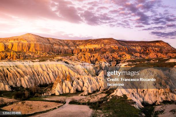 sunset over rose and red valley, cappadocia, turkey - göreme stock pictures, royalty-free photos & images