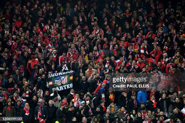 Liverpool supporters look on during the UEFA Champions league Round of 16 second leg football match between Liverpool and Atletico Madrid at Anfield...