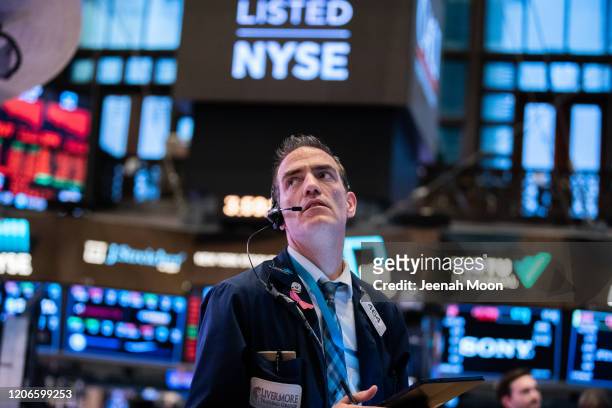 Traders work on the floor of the New York Stock Exchange on March 11, 2020 in New York City. The Dow plunged more than 1400 points as Coronavirus...