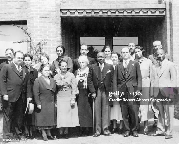 American newspaper publisher Robert Sengstacke Abbott as he poses with unidentified others at Hampton University, Hampton, Virginia, 1937.