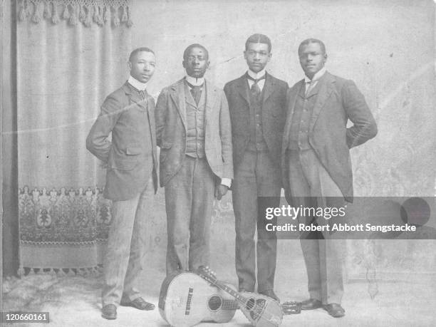 Portrait of the Hampton Quartet, among them American concert tenor and future newspaper publisher Robert Sengstacke Abbott , on the campus of the...