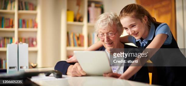 helping gran to connect - girl panoramic stock pictures, royalty-free photos & images