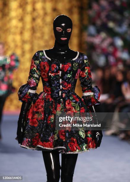 Model walks the runway at the Richard Quinn show during London Fashion Week February 2020 on February 15, 2020 in London, England.