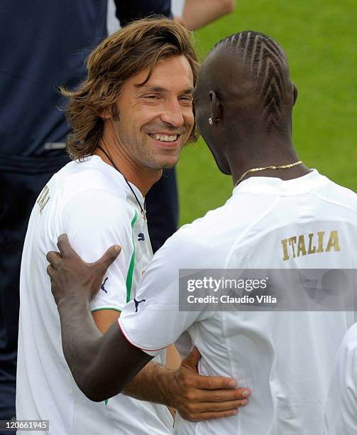 Mario Balotelli and Andrea Pirlo chat during Italy Training Session at Coverciano on August 8, 2011 in Florence, Italy.