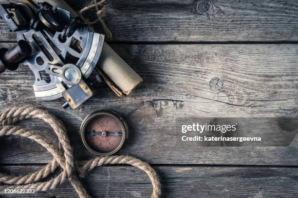 nautical equipment on the wooden background, high above - columbus day stock pictures, royalty-free photos & images