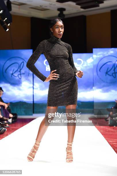 Model walks the runway for Rising Fashion at the House of iKons show at the Millennium Gloucester Hotel on February 15, 2020 in London, England.